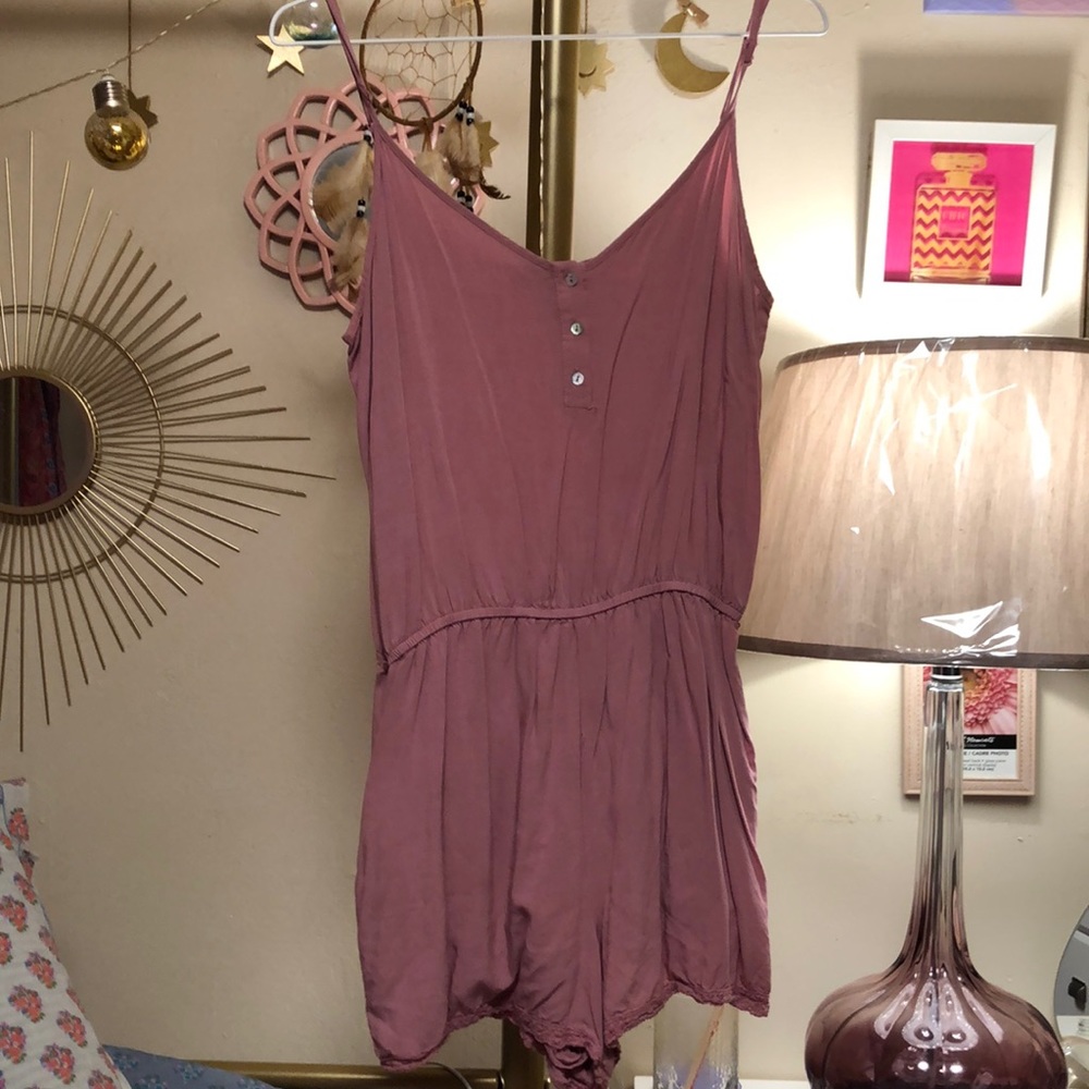 Forever 21 dark pink blush colored romper with pockets and lace detail on thigh